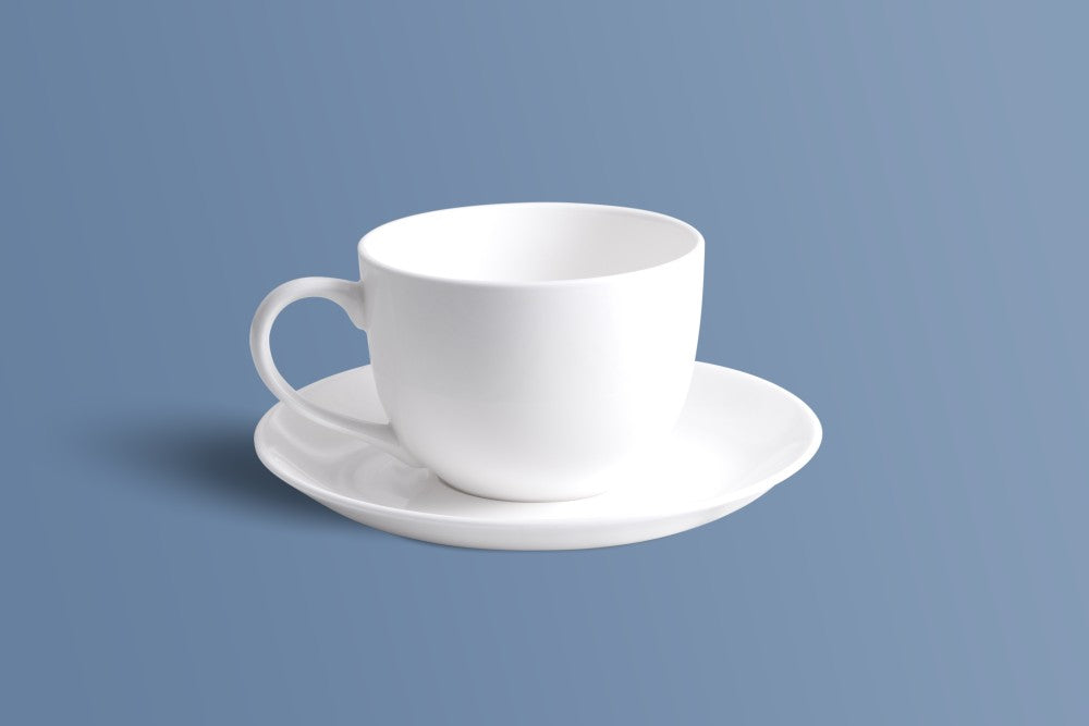 Plain white bone china cup and saucer set, undecorated finish.