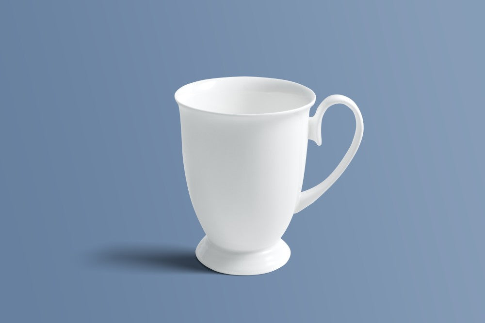 Plain white bone china mug on a pedestal foot, shown from the side.
