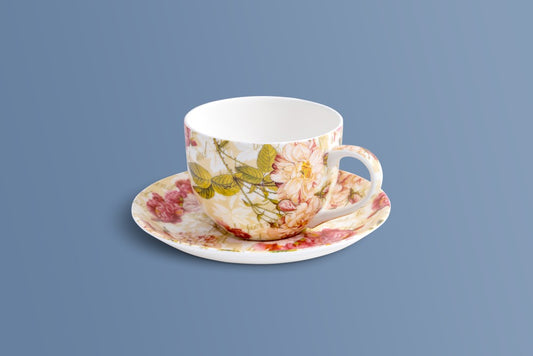 Rose & Verse bone china cup and saucer with a vintage rose pattern in pink, red and green.