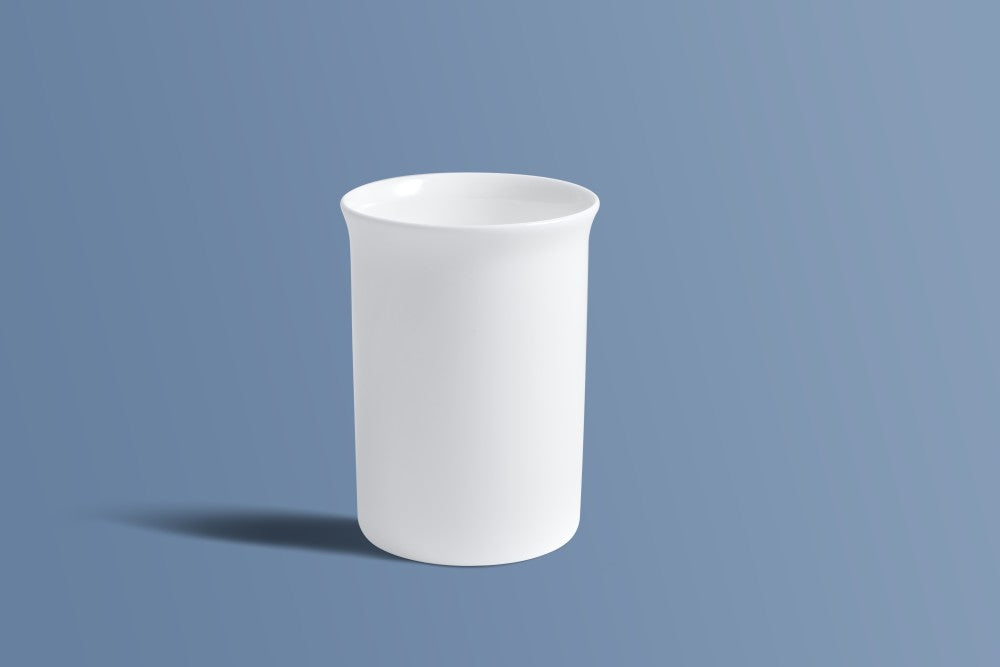 Plain white bone china coffee mug, undecorated finish, on a plain background.