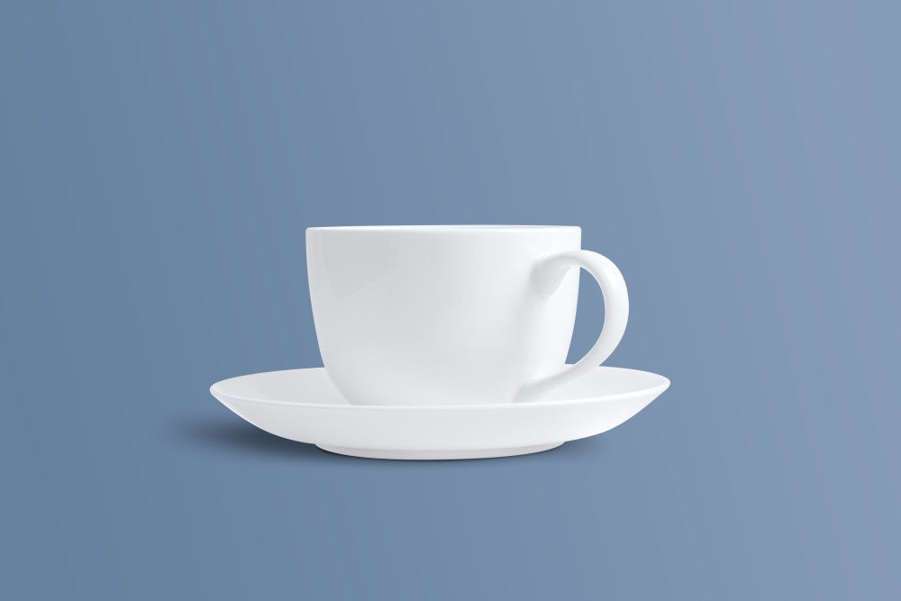 Plain white bone china cup and saucer showing the round-bellied cup shape.