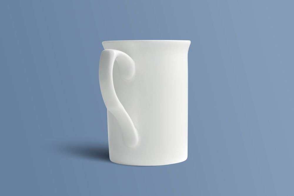 Plain white bone china mug showing its near-straight body and flared rim.