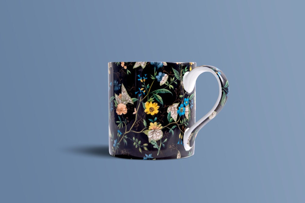 Botanica Noir bone china mug showing the white handle against the near-black botanical print.