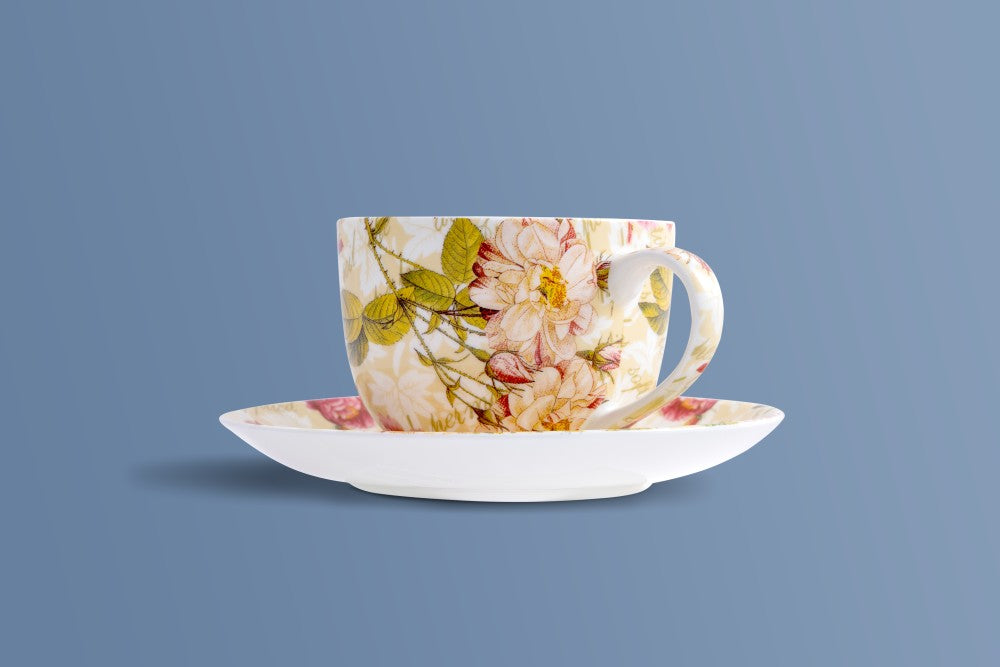 Rose & Verse bone china cup and saucer with blush, yellow and green floral detail.