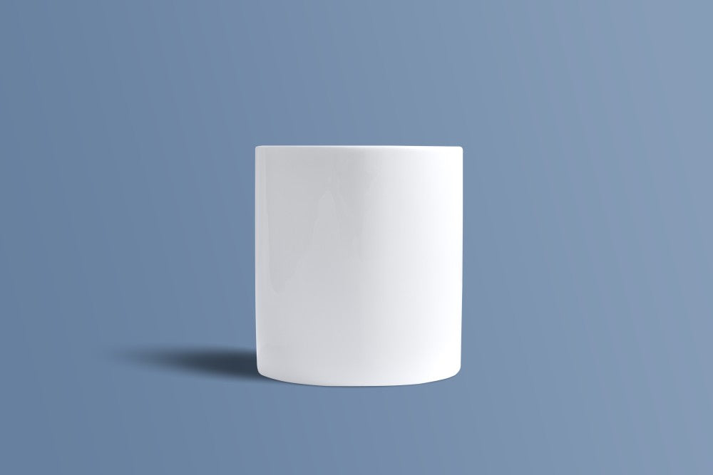 Plain white bone china mug seen from the back, showing its straight-sided profile.