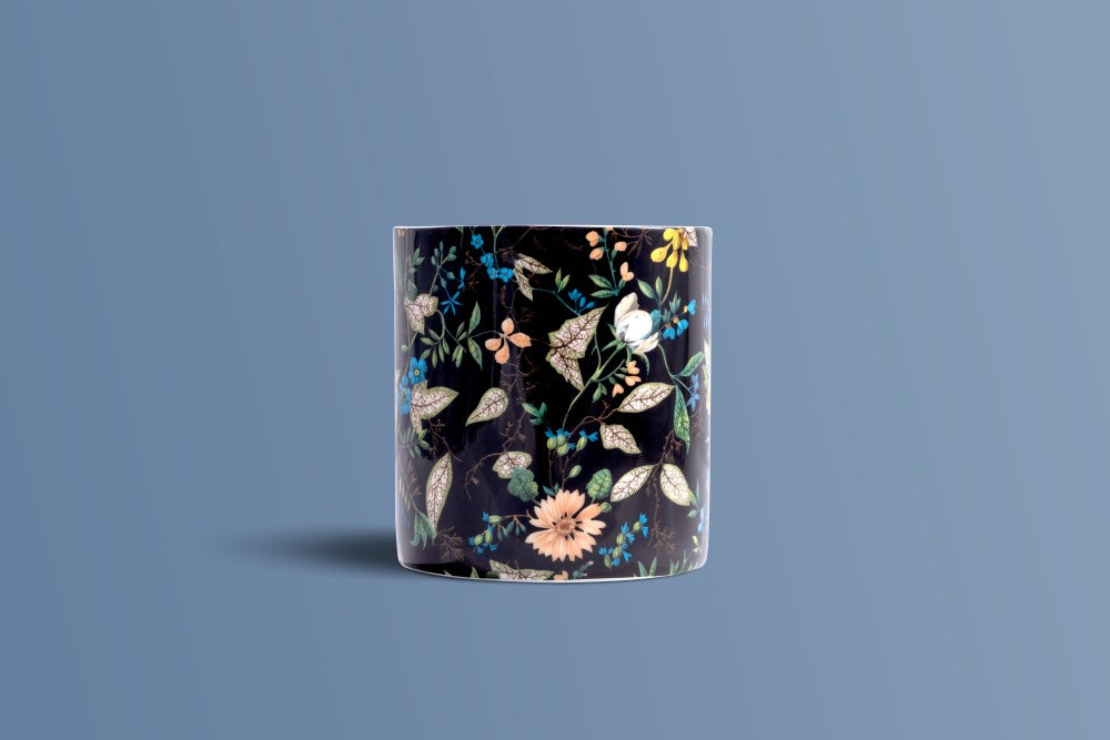 Botanica Noir bone china mug seen from the back, with the full botanical design on black.