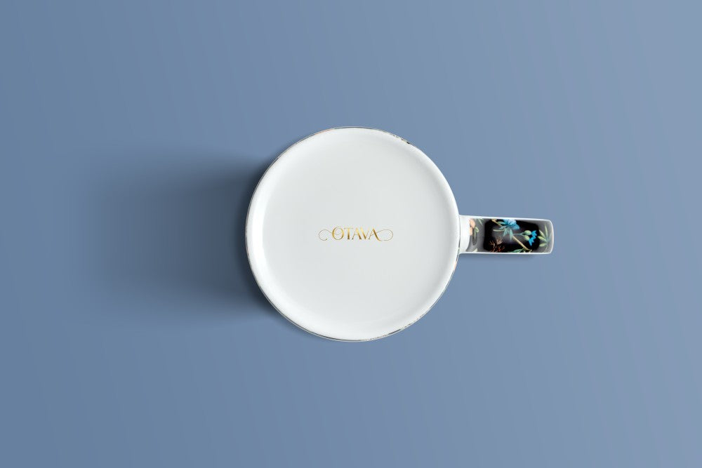 Botanica Noir bone china mug viewed from above, with the Otava mark inside the base.