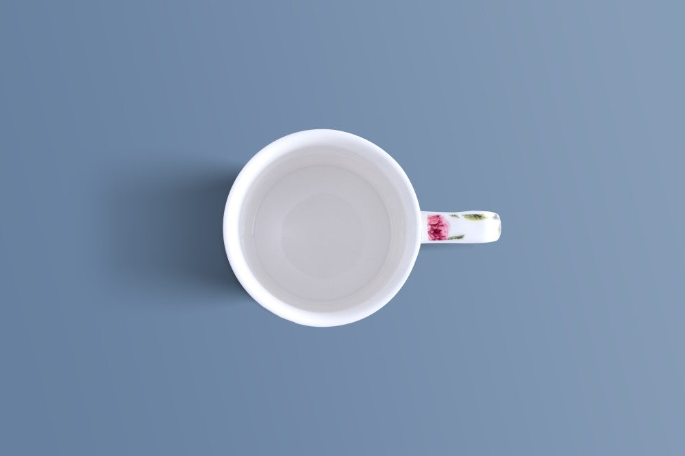 Overhead view of the English Rose & Butterfly bone china mug showing its floral patterned handle.