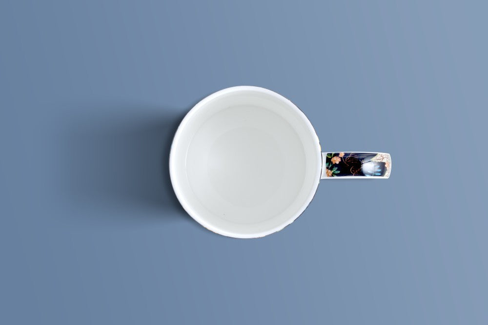 Overhead view of the Botanica Noir bone china mug showing its patterned handle.