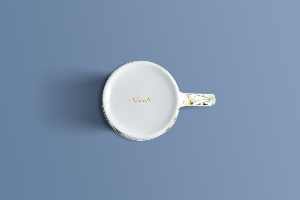 English Rose & Butterfly bone china mug viewed from above, with the Otava mark inside the base.