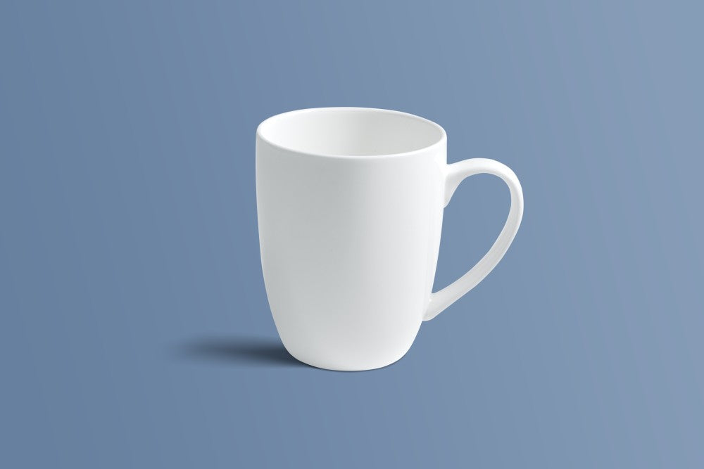Plain white bone china coffee mug shown from the side in a tall tapered silhouette.