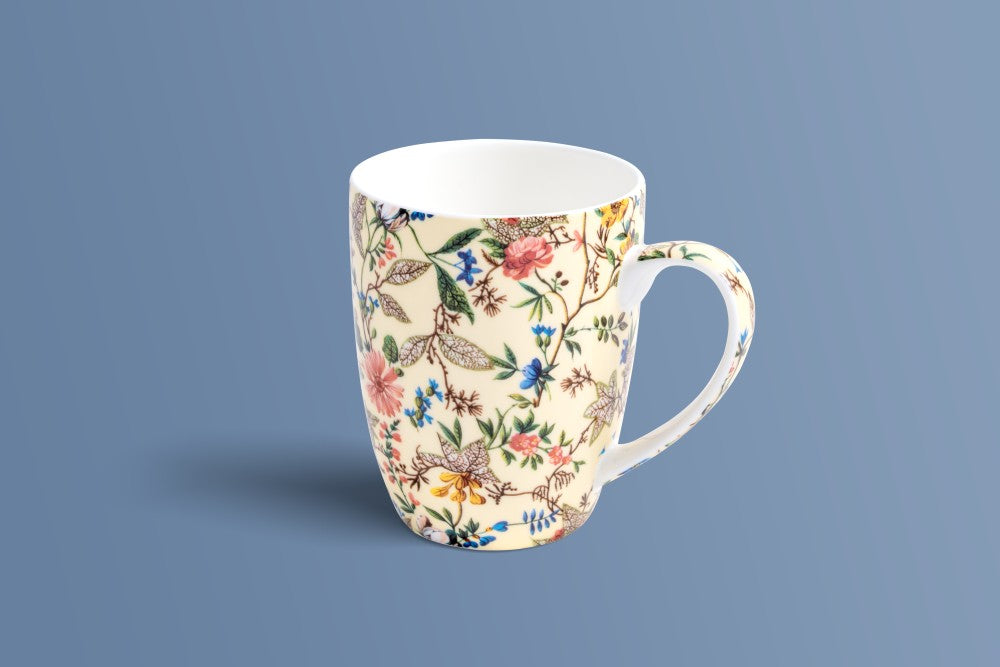 Botanica Cream bone china coffee mug shown from the side, multicoloured botanical pattern.