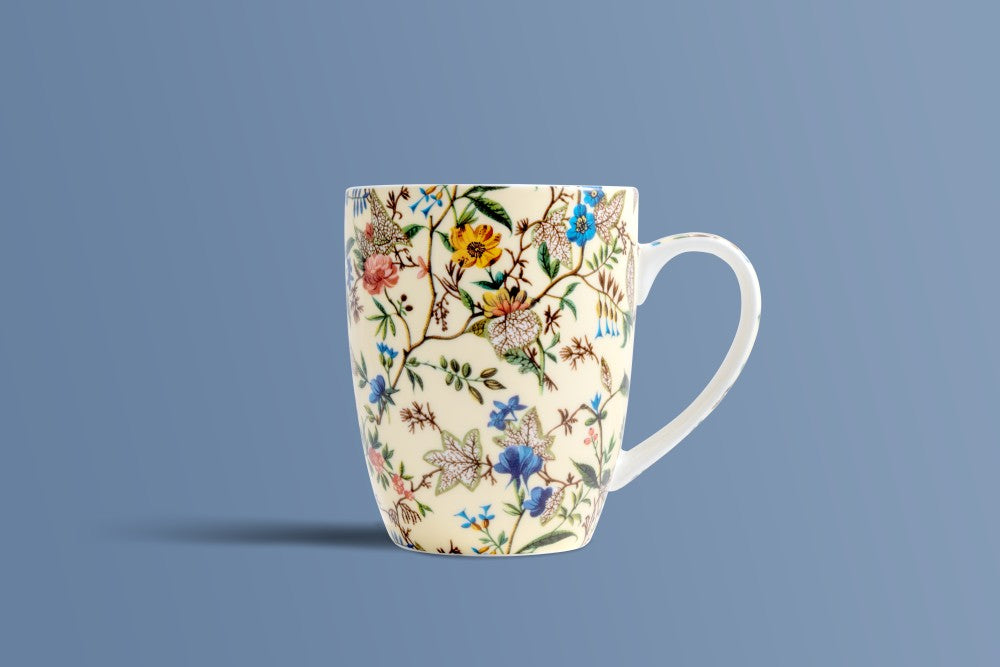 Tall tapered Botanica Cream bone china mug with an all-over botanical print.