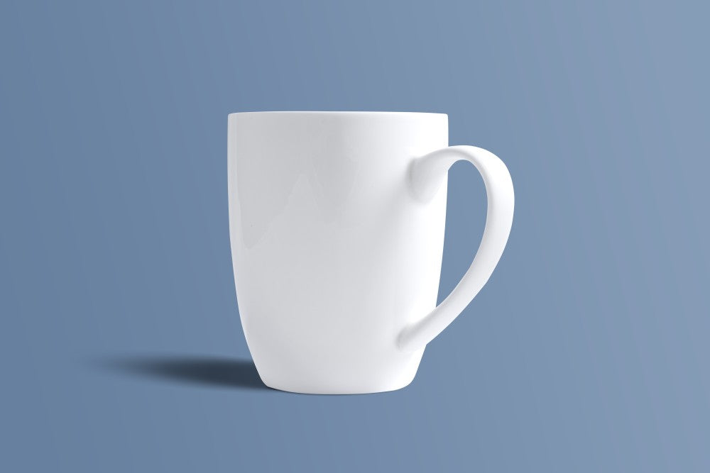 Plain white bone china coffee mug at a three-quarter angle, undecorated finish.