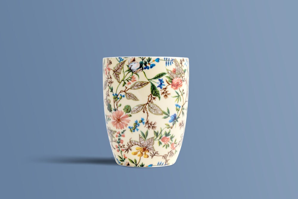 Botanica Cream bone china mug seen from the back, showing the full botanical print on ivory.