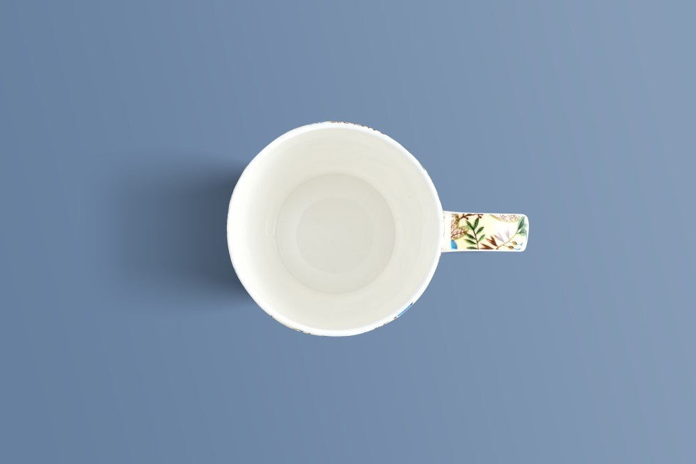 Top-down view of the Botanica Cream bone china mug showing its floral patterned handle.